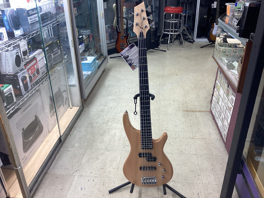 The Kona KE5BN 5-String Electric Bass Guitar has a bolt-on maple neck, and a traditional double cutaway alder body. This bass has been ergonomically designed for a great feel and ease of playing. Powered with a split pick-up configuration, it offers two v